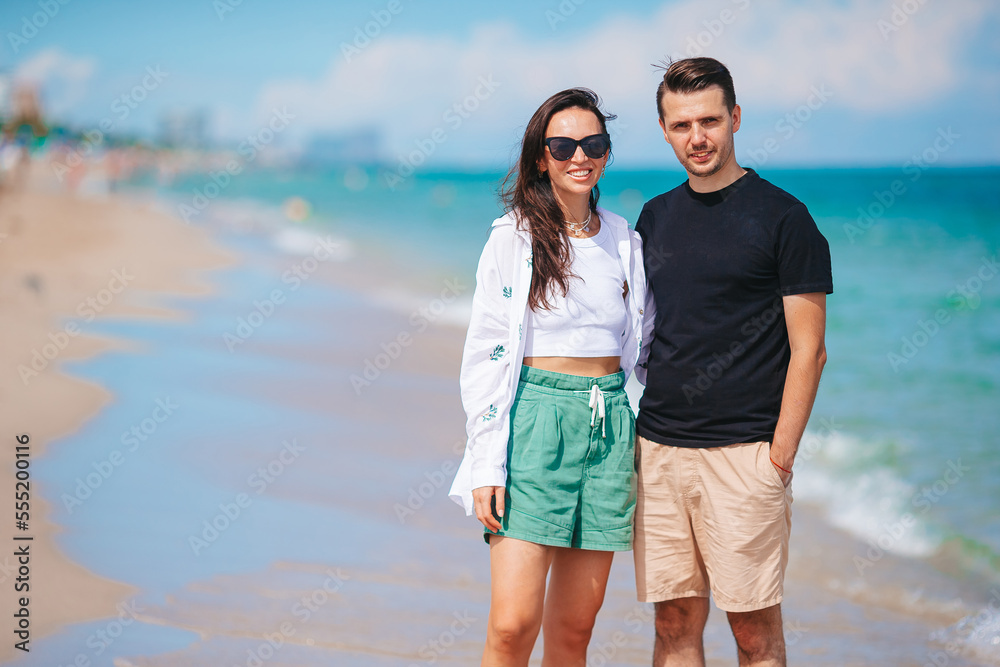 Young couple walking on the beach summer vacation. Young couple walking on the beach summer vacation.
