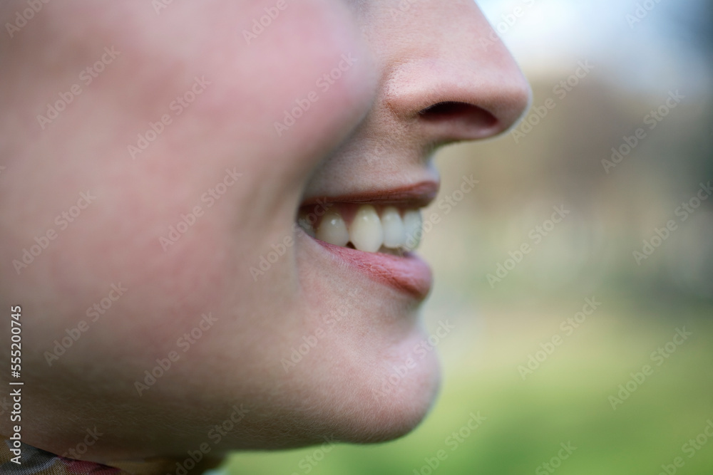 Profile of a young woman smiling. Profile of a young woman smiling.