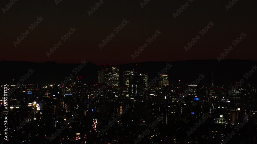 Aerial sunrise view of NAGOYA CITY in Japan. View of buildings and street traffic around Nagoya station and Sakae area (central downtown). Long time lapse shot, night to morning. Travel concept video. Aerial sunrise view of NAGOYA CITY in Japan. View of buildings and street traffic around Nagoya station and Sakae area (central downtown). Long time lapse shot, night to morning. Travel concept video.