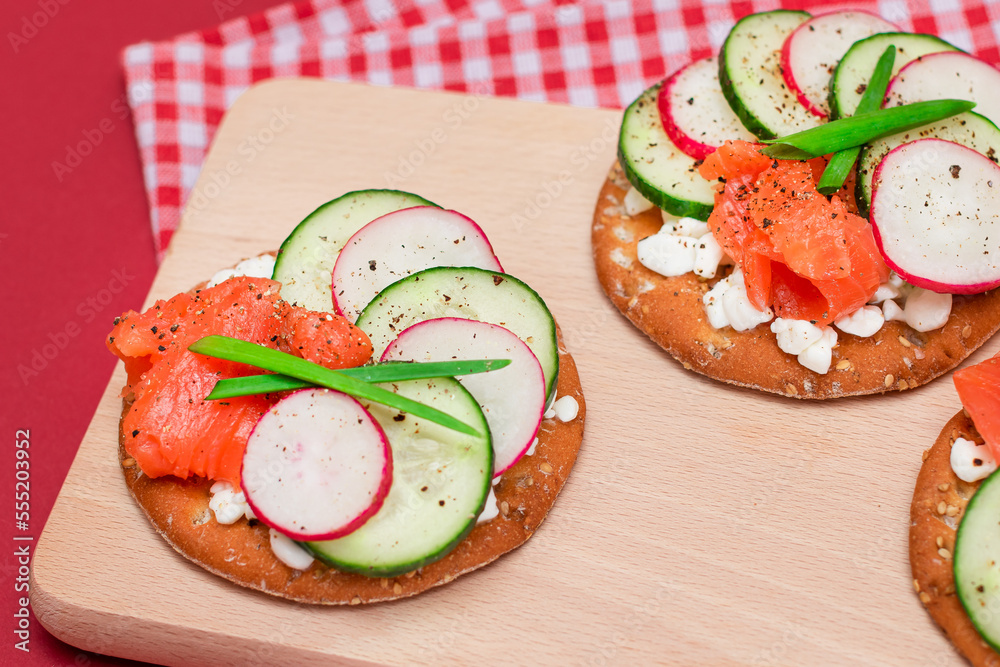 Crispy Cracker Sandwiches with Fresh Salmon, Cucumber, Radish, Cottage Cheese and Green Onions. Easy Breakfast. Quick and Healthy Sandwiches. Crispbread with Tasty Filling. Healthy Dietary Snack Crispy Cracker Sandwiches with Fresh Salmon, Cucumber, Radish, Cottage Cheese and Green Onions. Easy Breakfast. Quick and Healthy Sandwiches. Crispbread with Tasty Filling. Healthy Dietary Snack