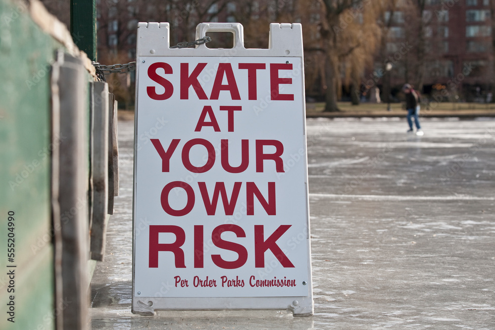 'Skate at Your Own Risk' warning sign in a public garden, Boston Public garden, Boston, Massachusetts, USA 'Skate at Your Own Risk' warning sign in a public garden, Boston Public garden, Boston, Massachusetts, USA