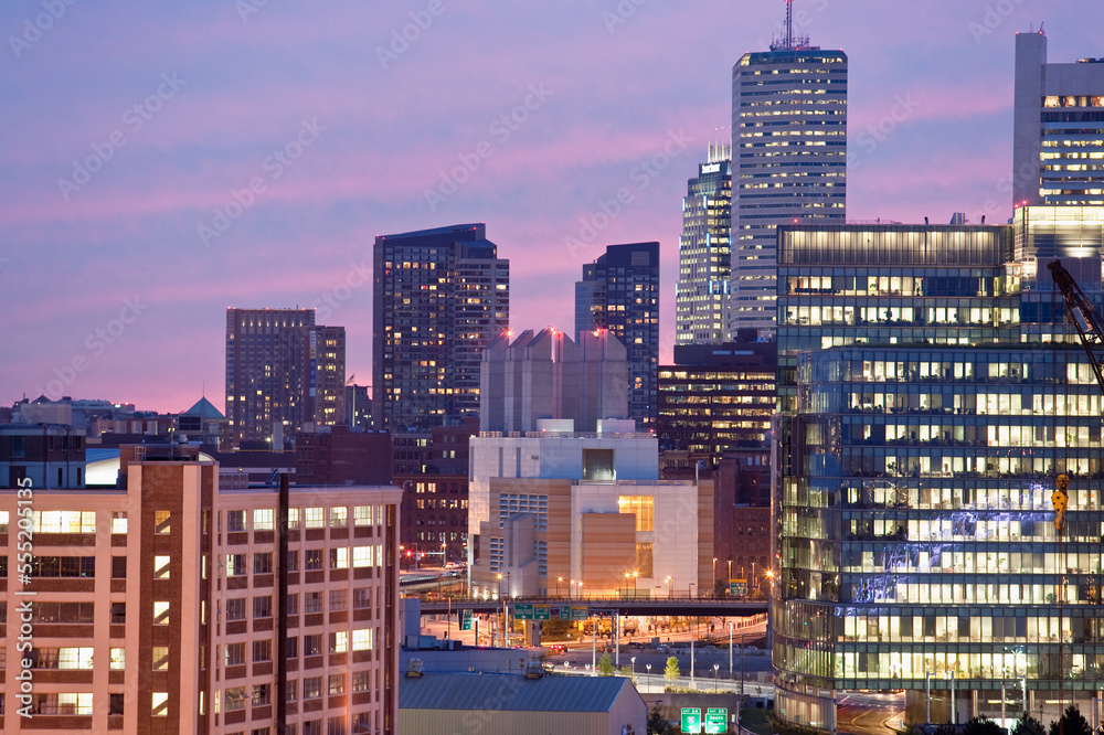 Buildings lit up at dusk, Seaport District, Boston, Massachusetts, USA Buildings lit up at dusk, Seaport District, Boston, Massachusetts, USA