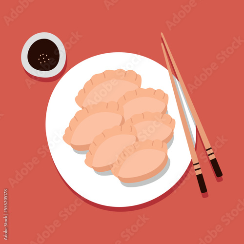 Jiaozi. Chinese New Year fried dumplings. Chopsticks, soy sauce. For menu, cafe, advertising