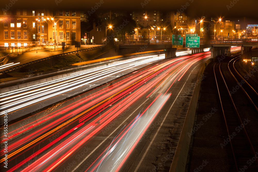 Streaks of lights of moving vehicles on the road, Mass Turnpike, Boston, Massachusetts, USA Streaks of lights of moving vehicles on the road, Mass Turnpike, Boston, Massachusetts, USA