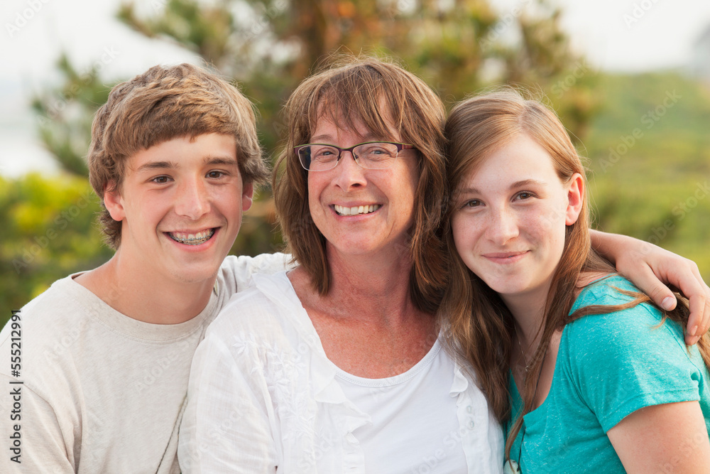 Portrait of a woman smiling with her children Portrait of a woman smiling with her children