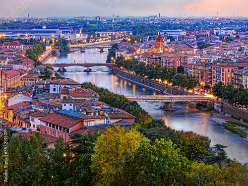 Verona, Veneto, Italy. View from the hill of San Pietro of Verona crossed by the Adige river at sunset.