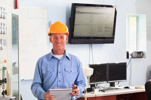 Electrical engineer in central operations room of power plant