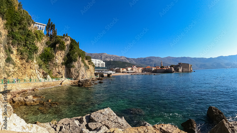 Unique pancake rock formations with panoramic view of the medieval old town of the coastal city of Budva, Montenegro, Adriatic Mediterranean Sea, Montenegro, Balkan, Europe. Dinaric alps in the back