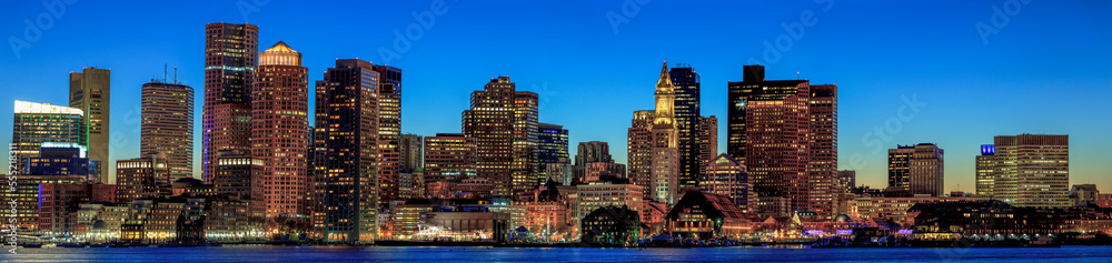 Boston skyline with the Seaport District and Moakley Courthouse at dusk viewed from East Boston, Massachusetts, USA Boston skyline with the Seaport District and Moakley Courthouse at dusk viewed from East Boston, Massachusetts, USA
