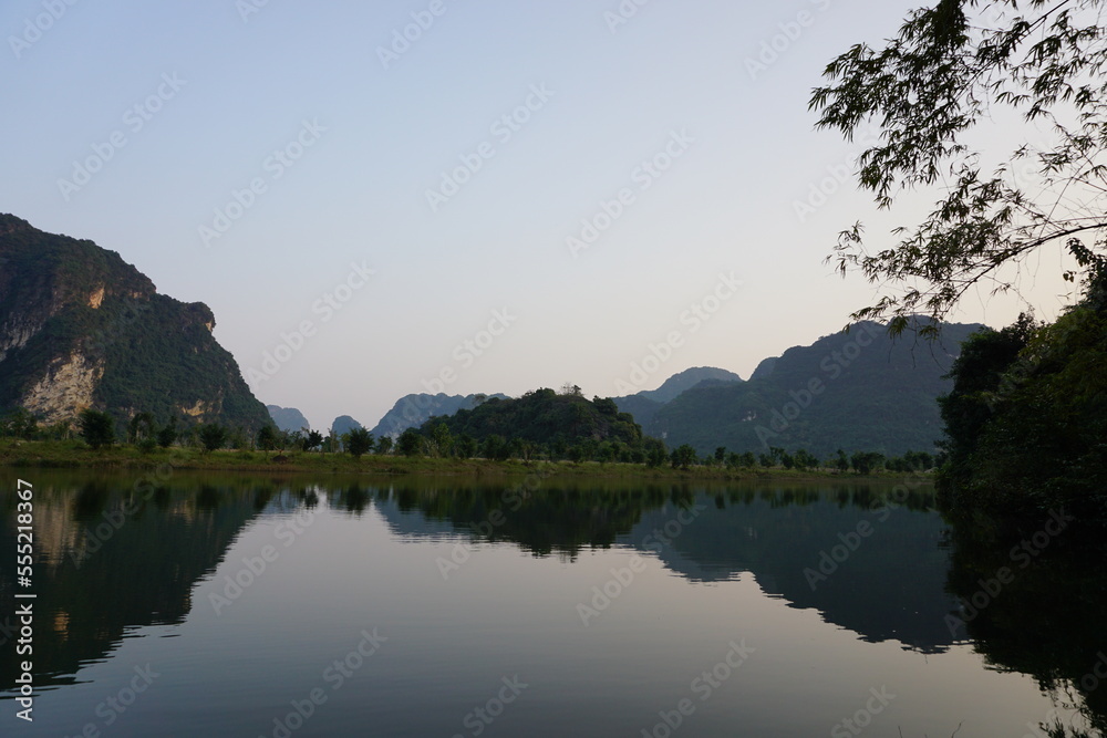 Sunset over the lake and mountains in the background in Vietnam