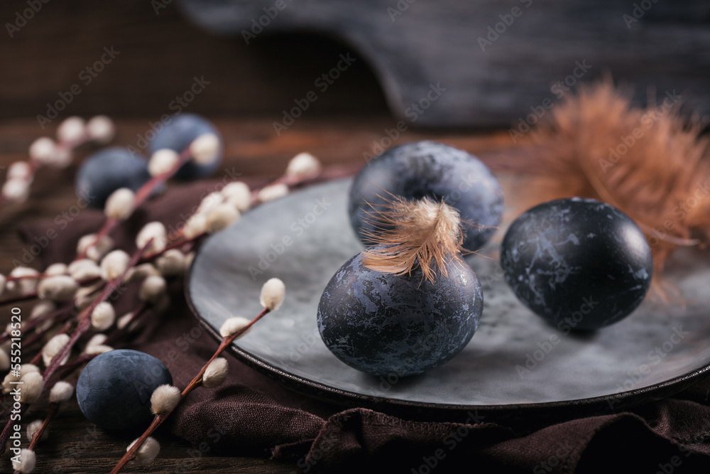Easter eggs painted by hand in blue color with marble stone effect on dark wooden background. Chicken and quail eggs for catholic and orthodox easter holiday Easter eggs painted by hand in blue color with marble stone effect on dark wooden background. Chicken and quail eggs for catholic and orthodox easter holiday