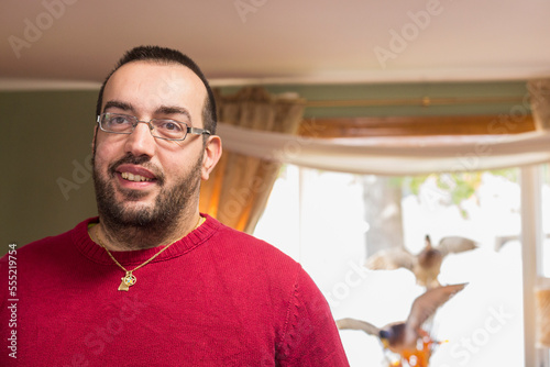 Happy man with Visual Impairment at home photo