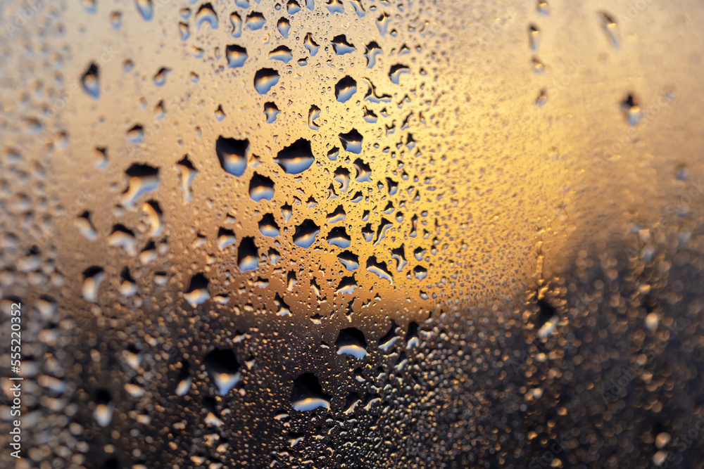 Magnificent sunset through the drops on the glass Magnificent sunset through the drops on the glass