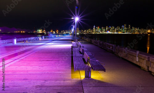 Lonsdale Quay illuminated with colourful lights at night; North Vancouver, British Columbia, Canada