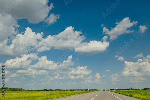 Big sky over a flat landscape with Highway 1, the Trans-Canada highway over the Canadian Prairies; Saskatchewan, Canada