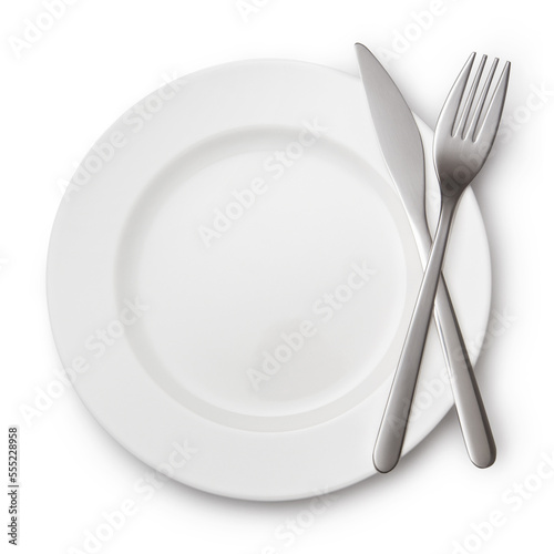 Knife and fork crossed on white plate, isolated on white background