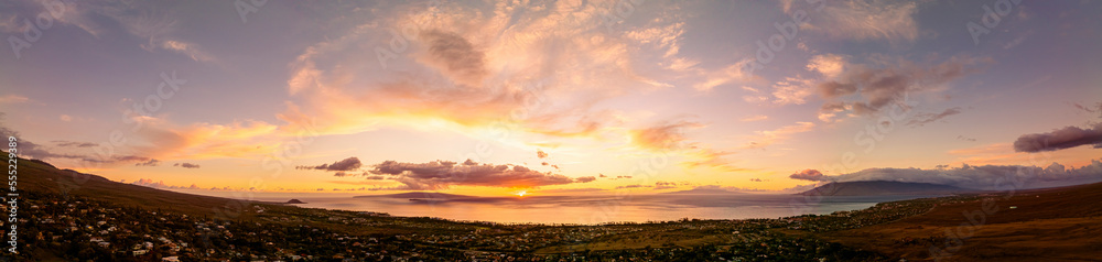 Aerial view of sunset over Kihei Town and the Pacific Ocean; Maui, Hawaii, United States of America Aerial view of sunset over Kihei Town and the Pacific Ocean; Maui, Hawaii, United States of America