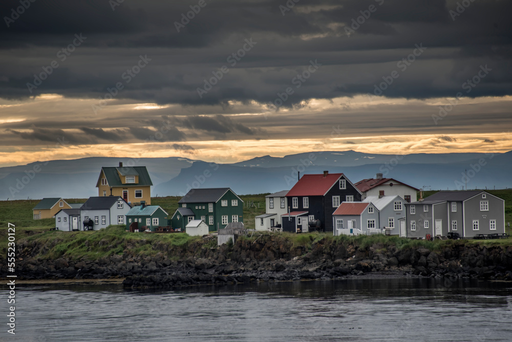 Houses along the shoreline on Flatey Island located in Breiðafjörður, Western Islands, Iceland Houses along the shoreline on Flatey Island located in Breiðafjörður, Western Islands, Iceland