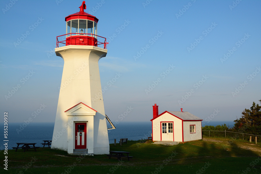 Lighthouse at Cap Gaspe, where the Appalachian Mountains meet the Atlantic ocean.; Forillon National Park, Gaspe Peninsula, Quebec, Canada. Lighthouse at Cap Gaspe, where the Appalachian Mountains meet the Atlantic ocean.; Forillon National Park, Gaspe Peninsula, Quebec, Canada.