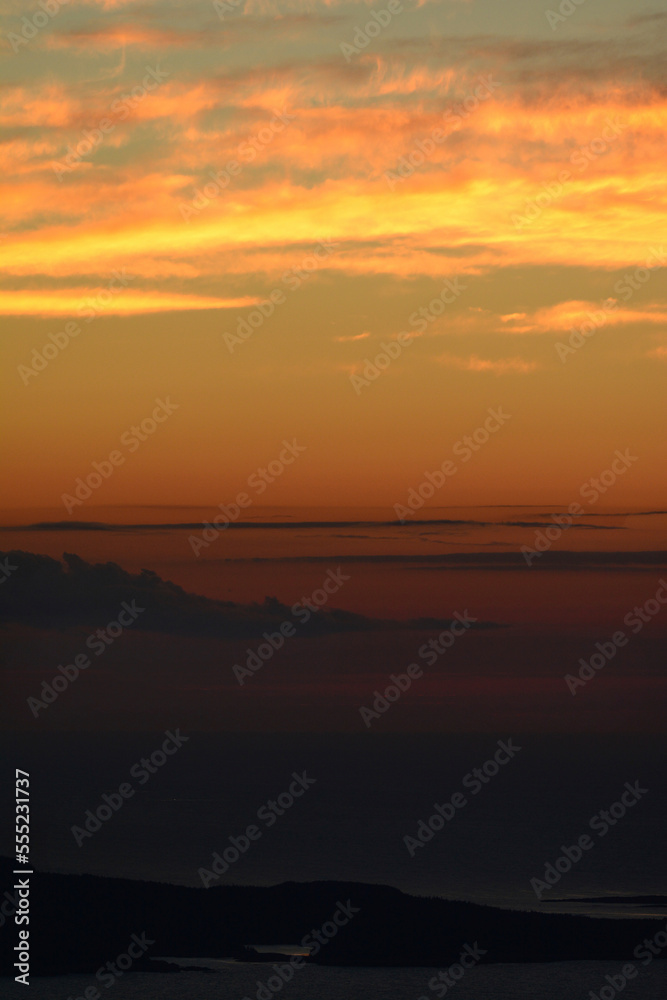 Pre-sunrise colors in the sky, seen from the summit of Cadillac Mountain.; Cadillac Mountain, Acadia National Park, Mount Desert Island, Maine. Pre-sunrise colors in the sky, seen from the summit of Cadillac Mountain.; Cadillac Mountain, Acadia National Park, Mount Desert Island, Maine.