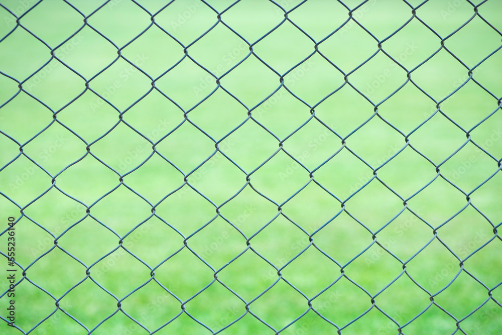 Wire fence with green background Wire fence with green background