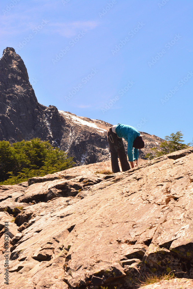 woman stretching in the mountains. outdoor exercise