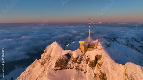 Aerial View of the Mountain Seantis in the Swiss Alps, Switzerland. Santis Weather Station, View Platform at sunset. photo