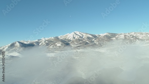 Aerial of low clouds in front of Park City Ski resort in Utah