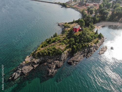 Aerial of Red Lighthouse on peninsula in Marquette, Michigan photo