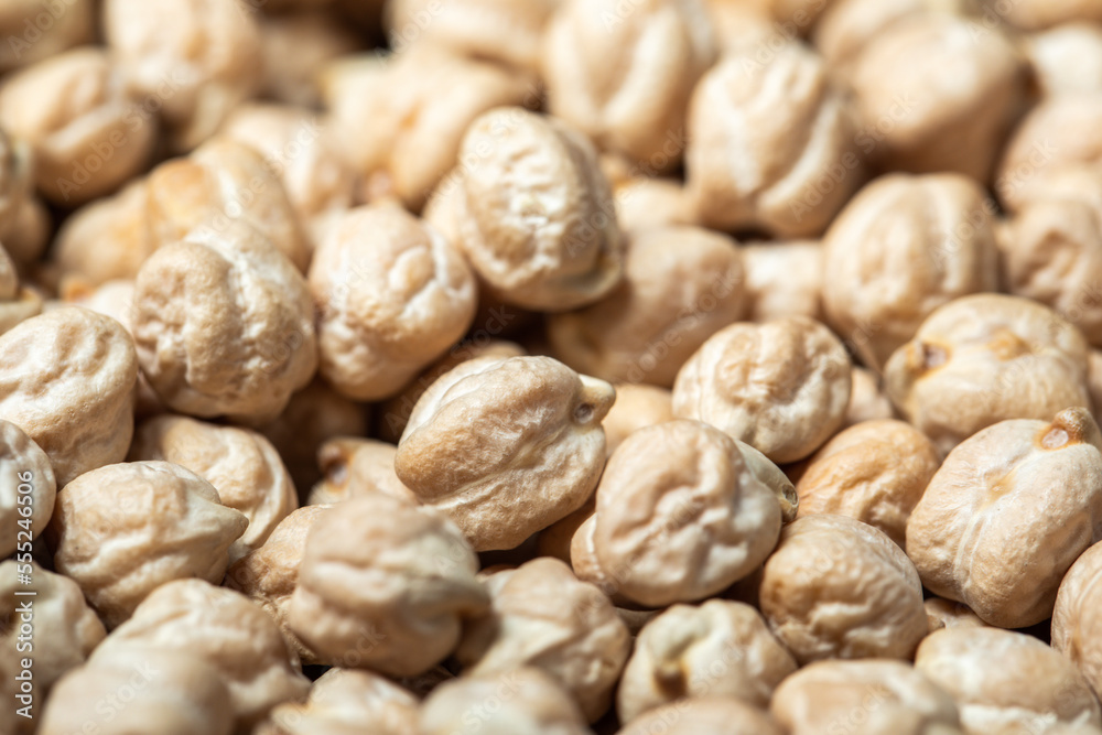 Dried raw chickpeas closeup. Organic food. Background of chickpeas. Legumes. Macro Dried raw chickpeas closeup. Organic food. Background of chickpeas. Legumes. Macro