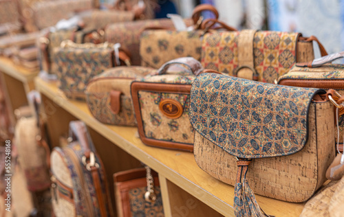 Portuguese souvenirs, brown cork bags, at the street market at the Nazare, Portugal.