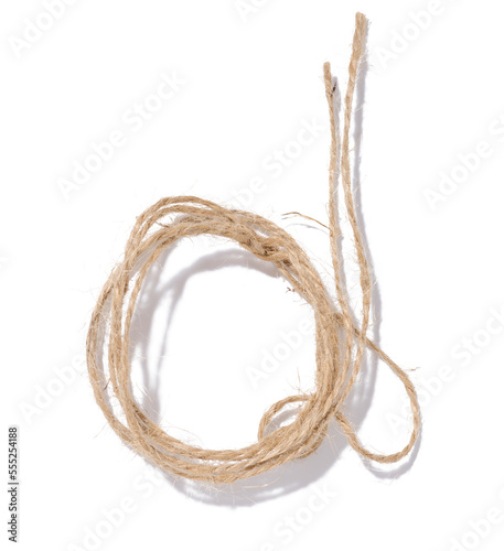 A skein of brown twine rope on a white isolated background  top view. Packing natural