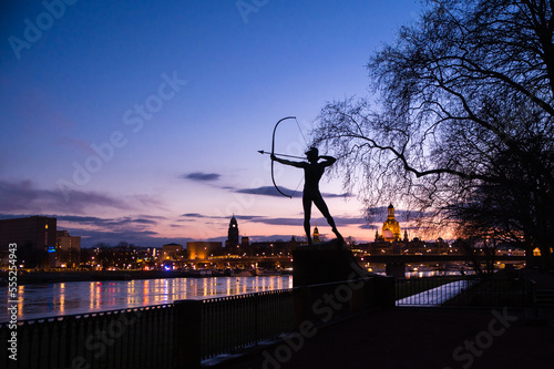 statue of archer at sunset with dresden vista in background