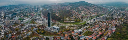 Aerial view around the capital city Sarajevo in Bosnia and Herzegovina on a cloudy and fogy day in autumn.