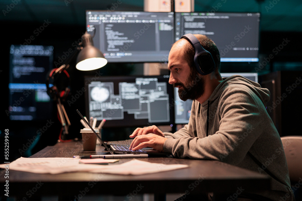 Software engineer typing code and creating algorithm for it startup company, writing html script on multiple monitors. App developer working with temrinal window and source code.