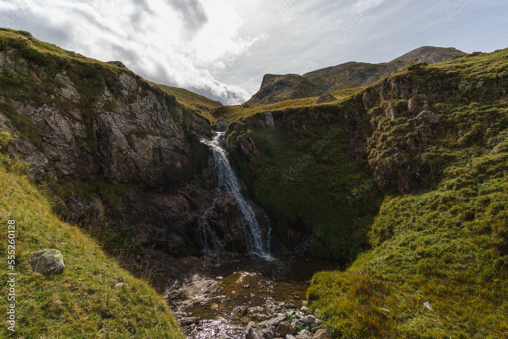 beautiful waterfall of small creek in Pyrenees Mountains, Col du Pourtalet, Nouvelle-Aquitaine France beautiful waterfall of small creek in Pyrenees Mountains, Col du Pourtalet, Nouvelle-Aquitaine France