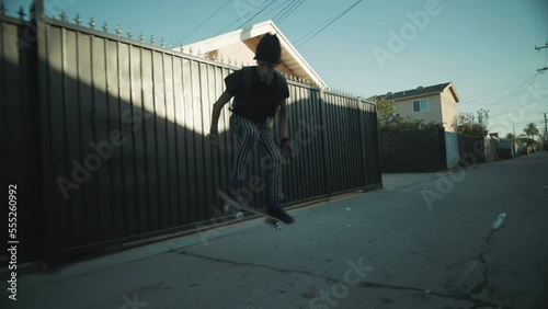 Mexican American Punk Rocker Skateboarding alleyway  photo