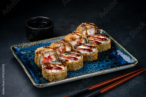 Tempura sushi rolls with shrimp, tuna, cream cheese, lettuce and teriyaki sauce.