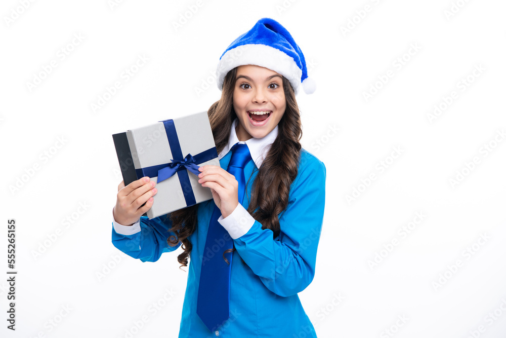 Santa child. Excited face. Funny kid girl in winter wear holding gift boxes celebrating happy New Year or Christmas. Winter holiday. Amazed expression, cheerful and glad. Santa child. Excited face. Funny kid girl in winter wear holding gift boxes celebrating happy New Year or Christmas. Winter holiday. Amazed expression, cheerful and glad.