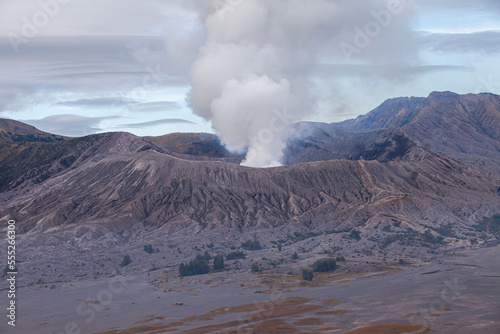 Mount Bromo with a puff of smoke from its caldera. Photographed with close up to see the natural details. The Bromo Tengger Semeru area is a popular tourist destination in East Java, Indonesia.