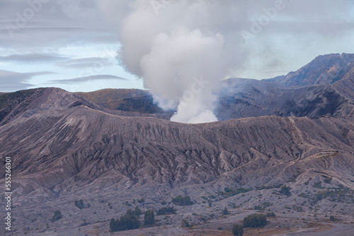 Mount Bromo with a puff of smoke from its caldera. Photographed with close up to see the natural details. The Bromo Tengger Semeru area is a popular tourist destination in East Java, Indonesia.