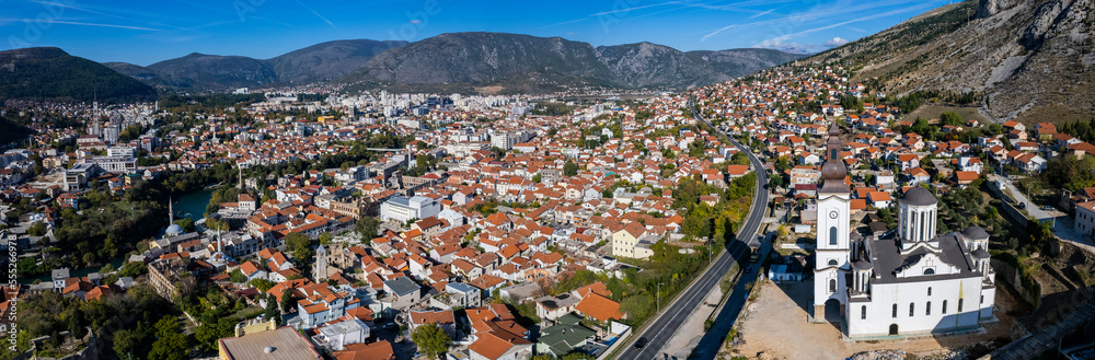 Aerial view around the capital city Mostar in Bosnia and Herzegovina on a sunny day in autumn.	