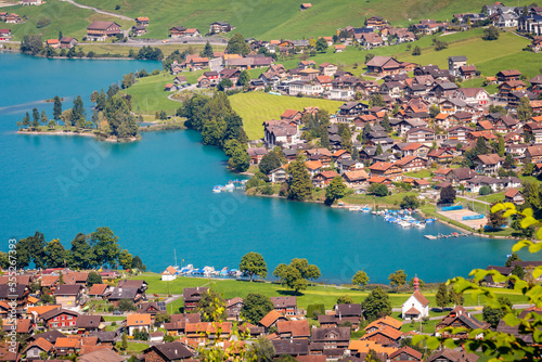 Turquoise Lungernsee and village lungern in the Swiss Alps, Switzerland © Aide