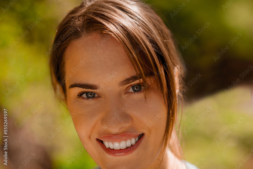 Portait picture of a young smiling woman