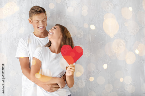 Happy young couple with red...