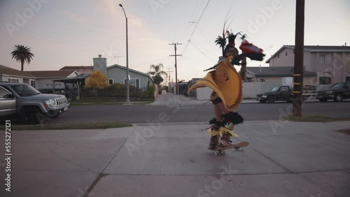 Mexica Aztec Dancer Skateboarding Spin photo