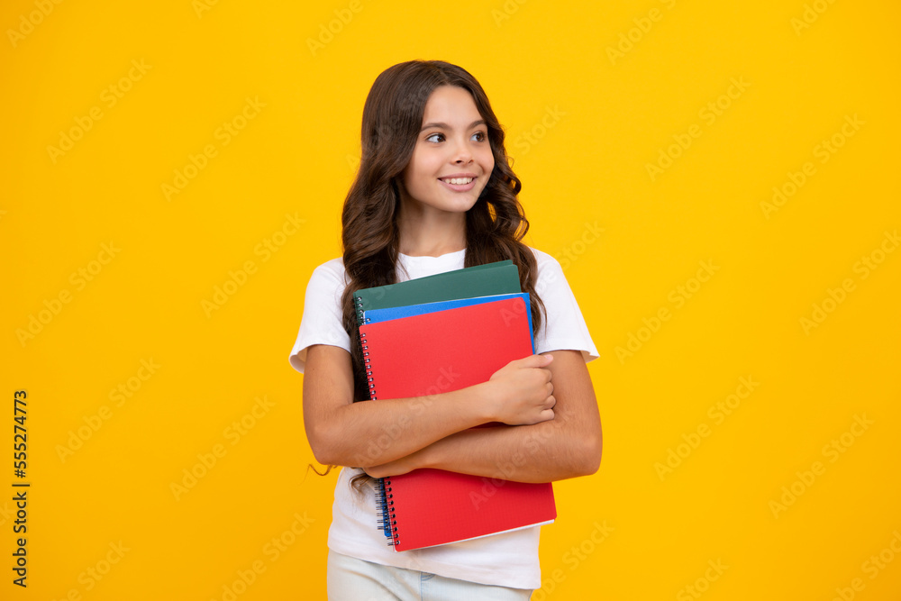 Teenager school girl with books isolated studio background. Teenager school girl with books isolated studio background.