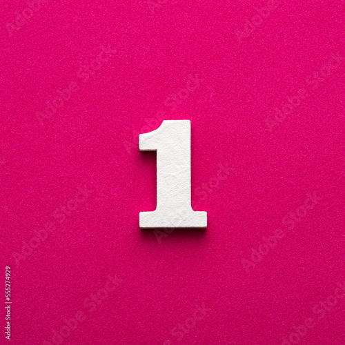 Number 1 - White wooden number on rhodamine red background