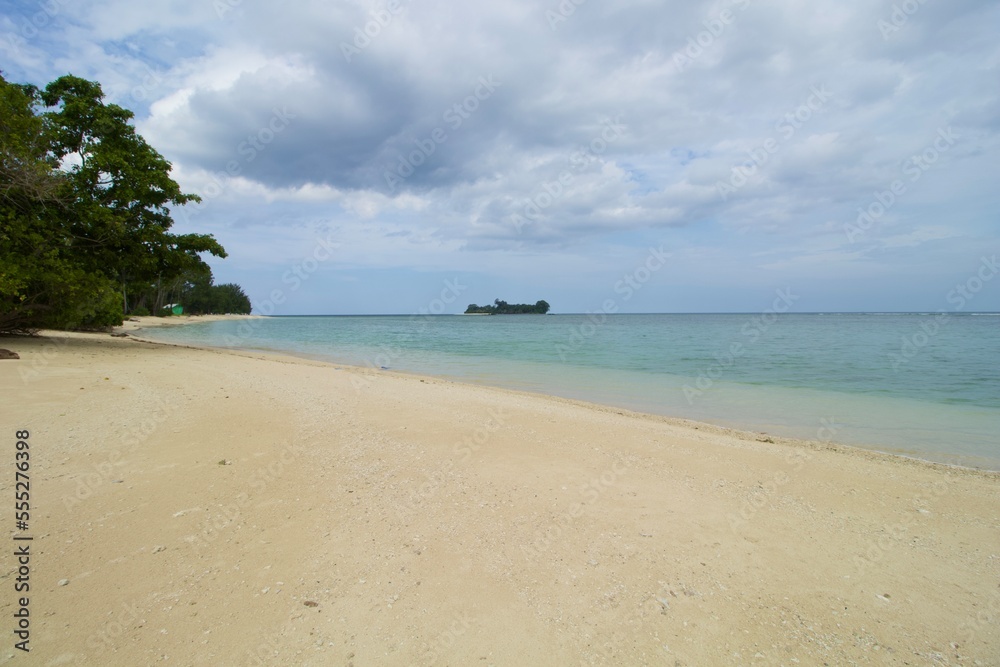 Tropical Beach, Wave and Blue Sea Water. This photo was taken on one of the tropical islands in Kotabaru, Indonesia.