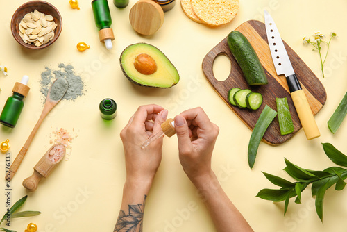 Woman applying essential oi...